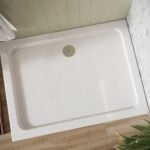 a shires 1000 x 800mm rectangle shower tray with a chrome shower waste