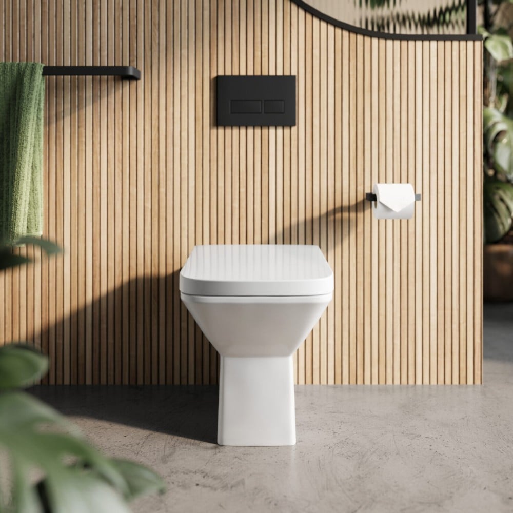 Puriti Rimless Back To Wall Pan & Soft Close Seat With Wood Effect Background