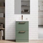 Blake Reed Green Twin Drawer 500mm Floor Standing Vanity Unit With Brushed Bronze knurled handles against a white wall & a oak finish floor with a rectangle plain mirror above.